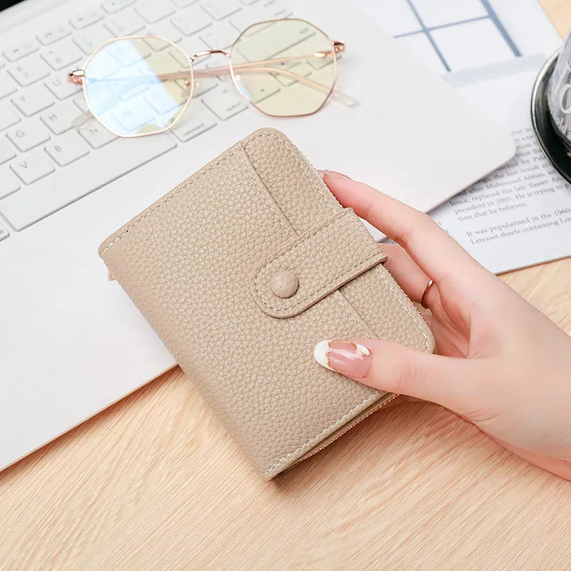 Ladies short wallet with lychee pattern texture in two-fold bifold design
