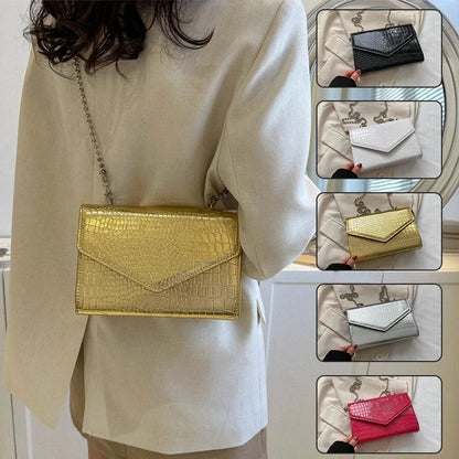Clamshell handbag with crocodile pattern and soft handle in various colours