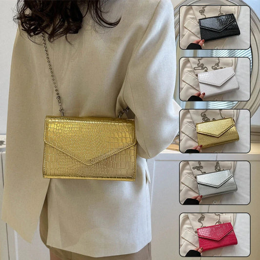 Clamshell handbag with crocodile pattern and soft handle in various colours