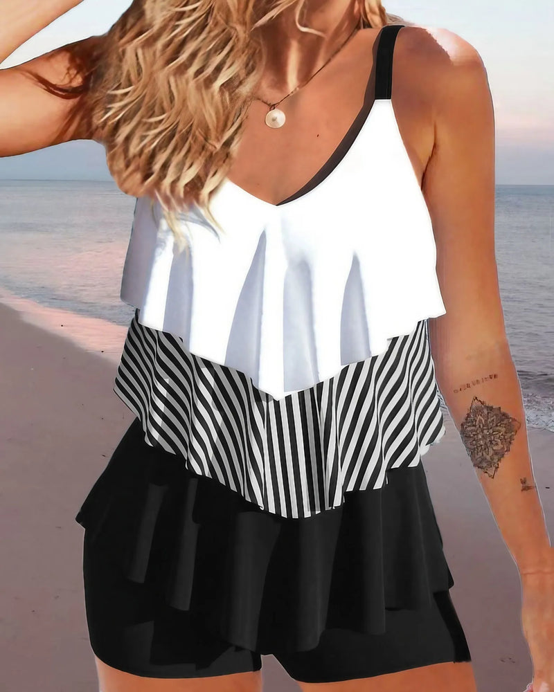 Women's swimsuit in sleeveless backless spaghetti-strap bikini split style with ruffle detail, made from polyester fibre fabric, available in sizes S to 2XL with solid, floral, gradient and sexy colour patterns, for swimming and wading activities.