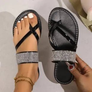 Women's flat beach sandals with rhinestone toe strap in black, gold or silver colours
