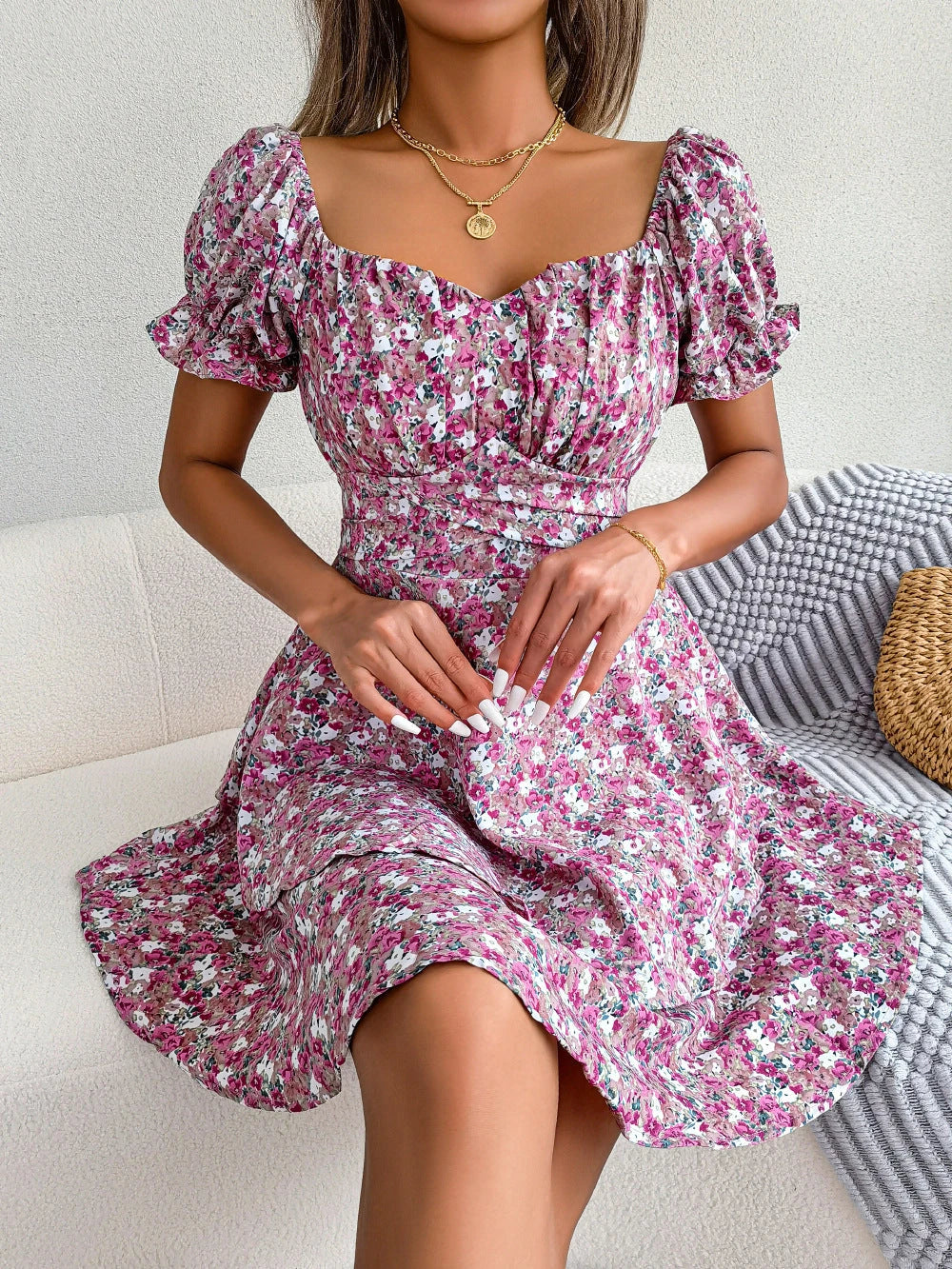 Stylish floral mini dress with ruffled skirt, high-waist design, and short sleeves for a flattering and comfortable summer look