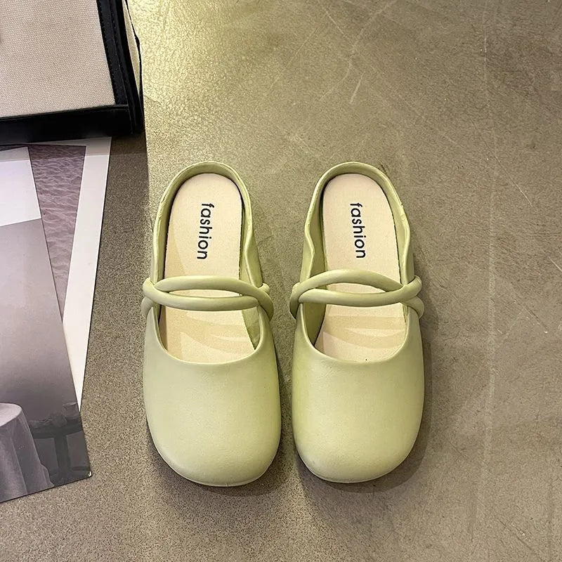 Women's baotou plastic flip-flop sandals in beige colour on a white background