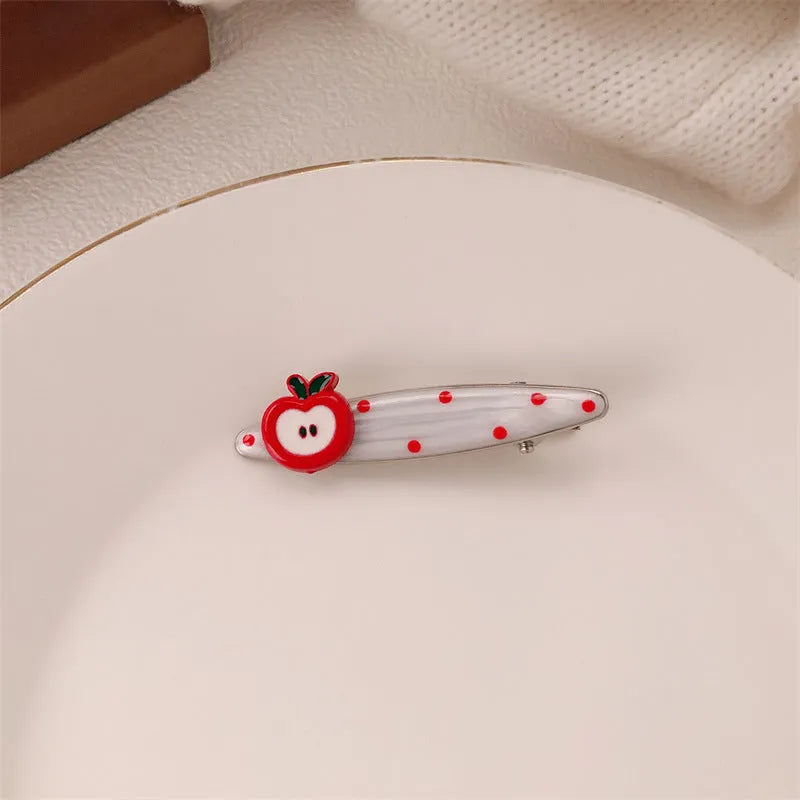 Red love heart-shaped hair barrette clip with retro white dots on a willow leaf-shaped base.