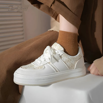 Beige and plaid patterned platform sports shoes with round toe and white rubber sole.