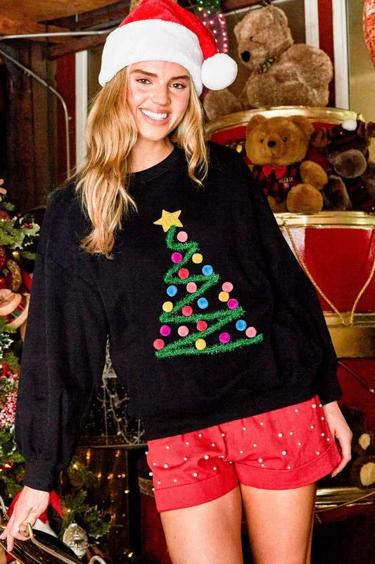 Festive Christmas tree graphic on a cozy, oversized women's hoodie sweater in black and milky white colors