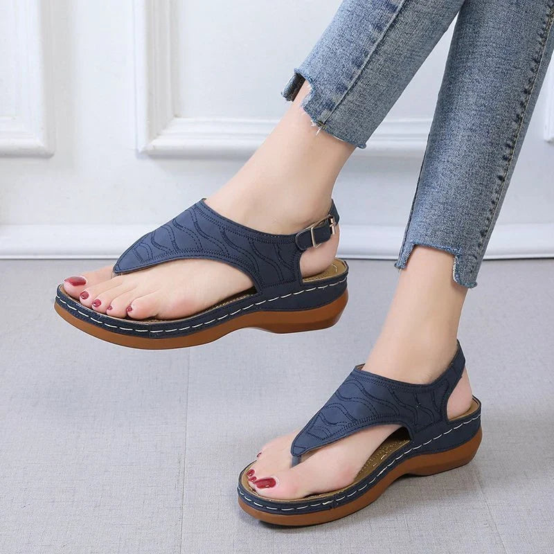 Comfortable women's wedge sandals in various colors with adjustable straps and a lightweight sole