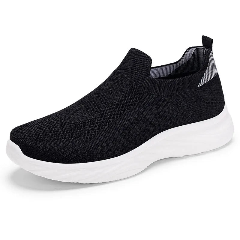 Women's Flyknit casual running shoes with soft PVC sole in black, grey, pink, and blue colour options.