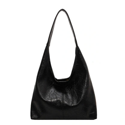 Classic vintage-inspired women's shoulder bag in a range of sophisticated colours, featuring a roomy interior, adjustable strap, and premium materials for timeless British style.