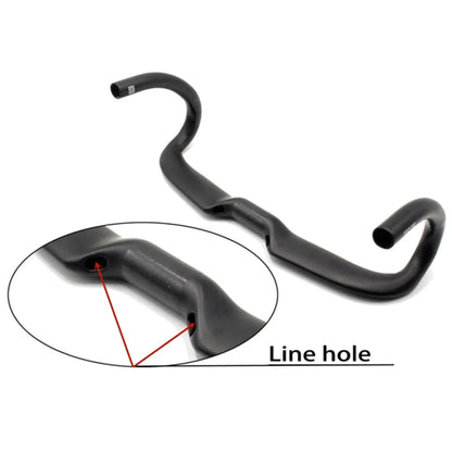 Matt carbon fibre road bike drop handlebar showing bent shape and clamp area.