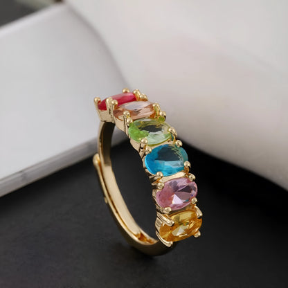 Adjustable gold-colour copper ring with zircon detail on woman's finger