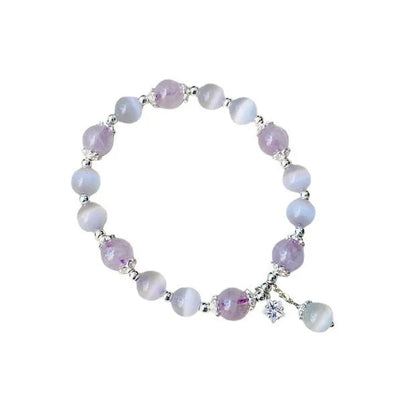 Moon-shaped women's bracelet with large opal amethyst crystal beads on wrist.