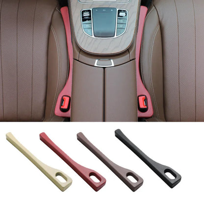Polyurethane car seat gap filler strip in assorted colours on a car seat.