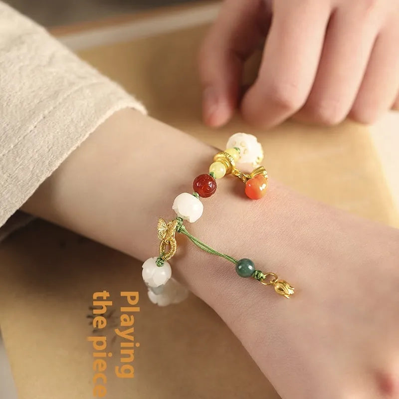 White jade Bodhi bracelet with lotus and pumpkin beads on open rope design