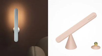 White geometric desk lamp with magnetic base and touch control on a wooden table.