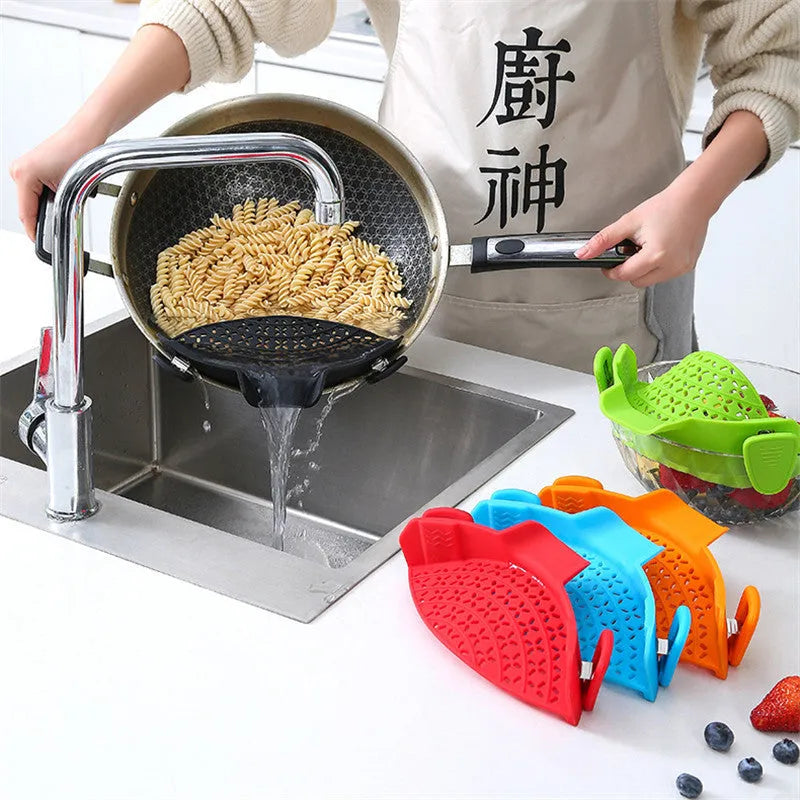 Silicone and stainless steel pot side drain stopper kitchen gadget in assorted colours.