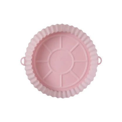 Round blue silicone baking tray mat with 4.5cm sides on a kitchen counter.
