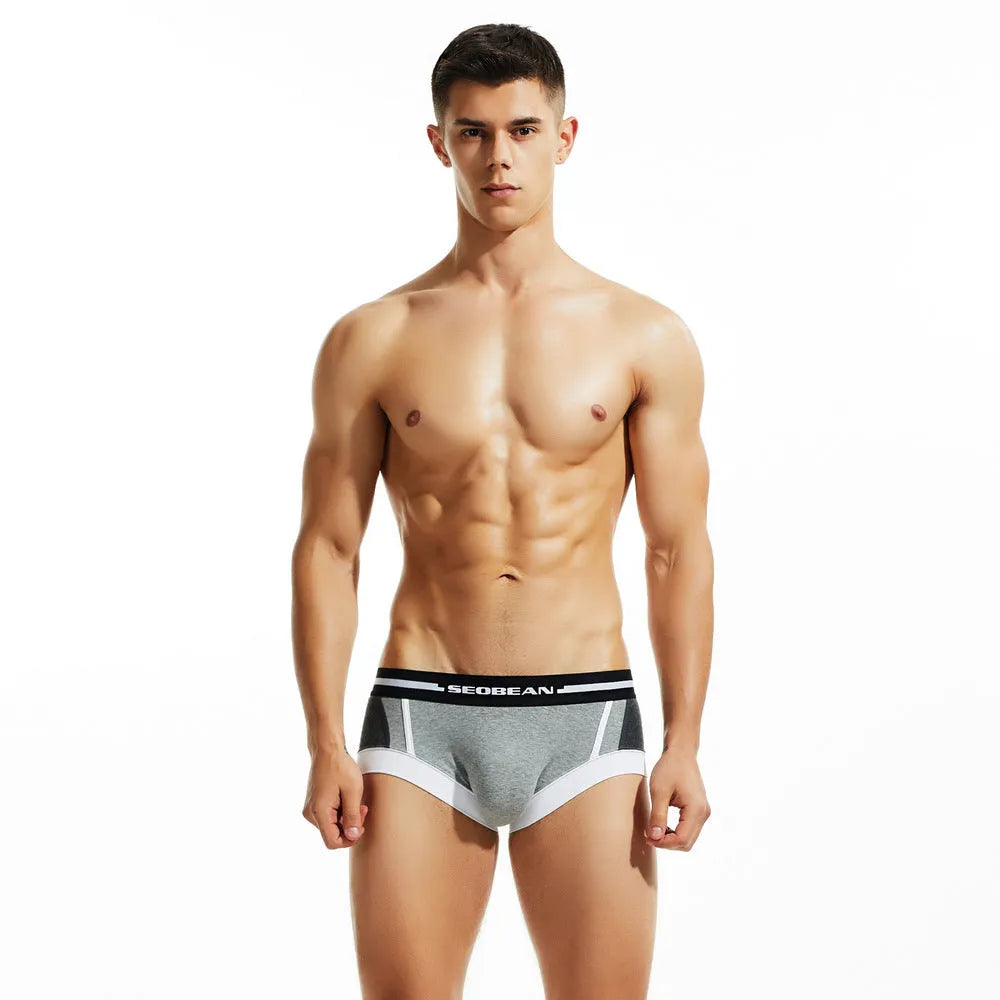 Men's cotton low waist boxer shorts in red, dark blue, and light grey colours.