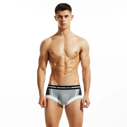 Men's cotton low waist boxer shorts in red, dark blue, and light grey colours.