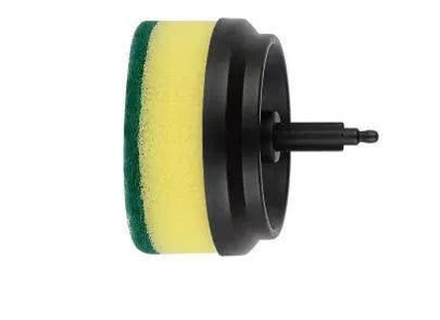 Green electric cleaning brush with multiple brush heads on a kitchen worktop.