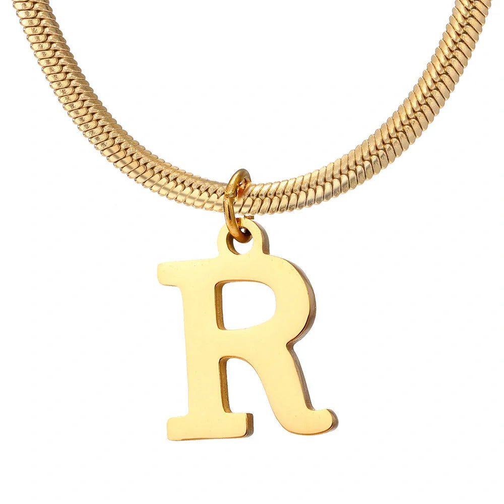 Elegant gold A-Z letter pendant necklace on a snake chain