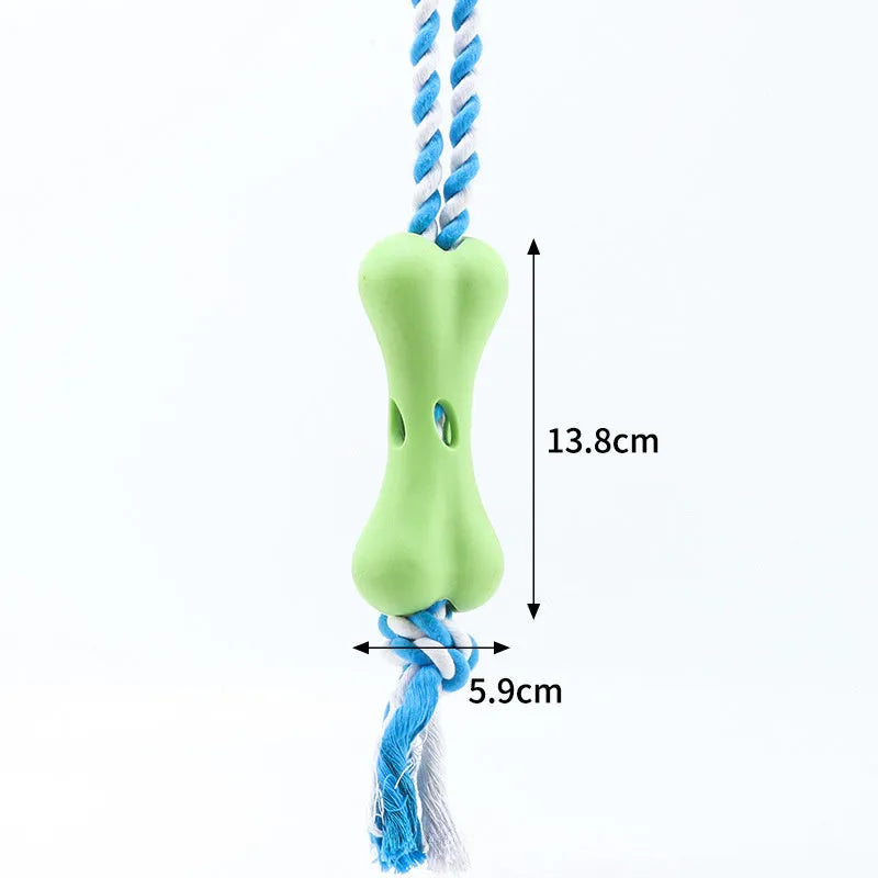 Green porous bone dog toy with knotted rope, hollow for treats, measuring 138mm