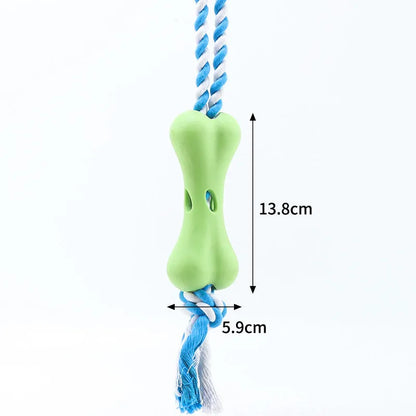 Green porous bone dog toy with knotted rope, hollow for treats, measuring 138mm