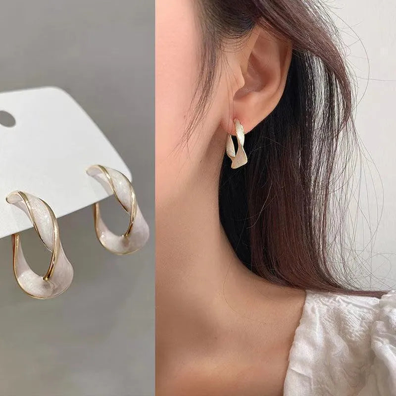 Cream white geometric C-shaped drop oil earrings with electroplated alloy finish in Fashion OL style