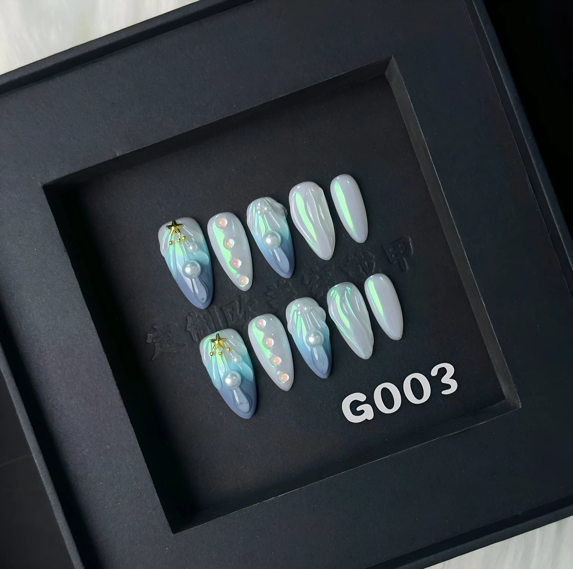 Blue shell design plastic nail tips in sizes XS, S, M, L from Hailang.