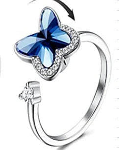 Adjustable spinner ring with rotating floral, geometric, and nature-inspired motifs for women's fashion and stress relief