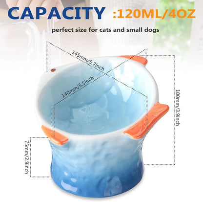 Set of four blue fish-shaped ceramic cat bowls with a tilted design on a wooden floor.