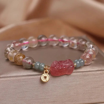 Colourful hair crystal stretch bracelet with cat's paw, butterfly, flower, and purse charms on adjustable band