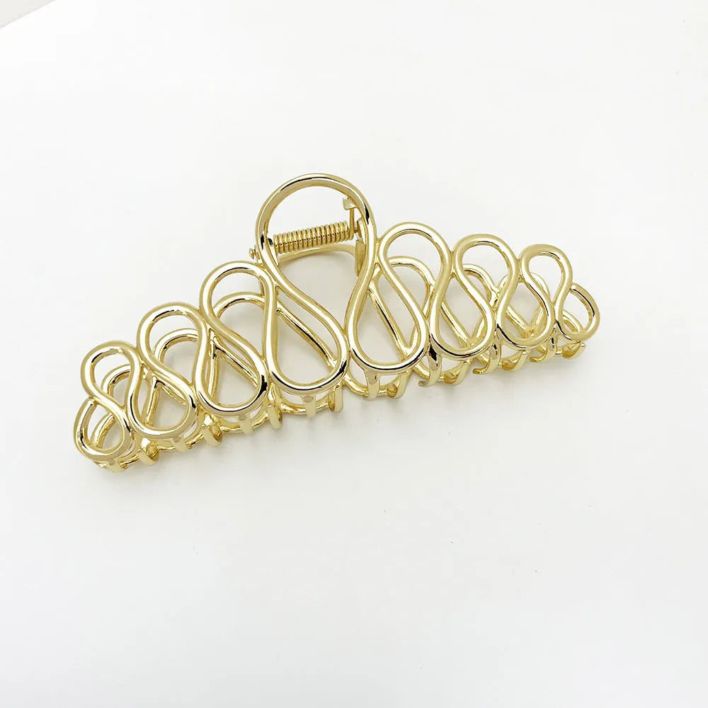 Large minimalist alloy hair clip with electroplated gold finish and irregular tassel decoration for creating updo hairstyles