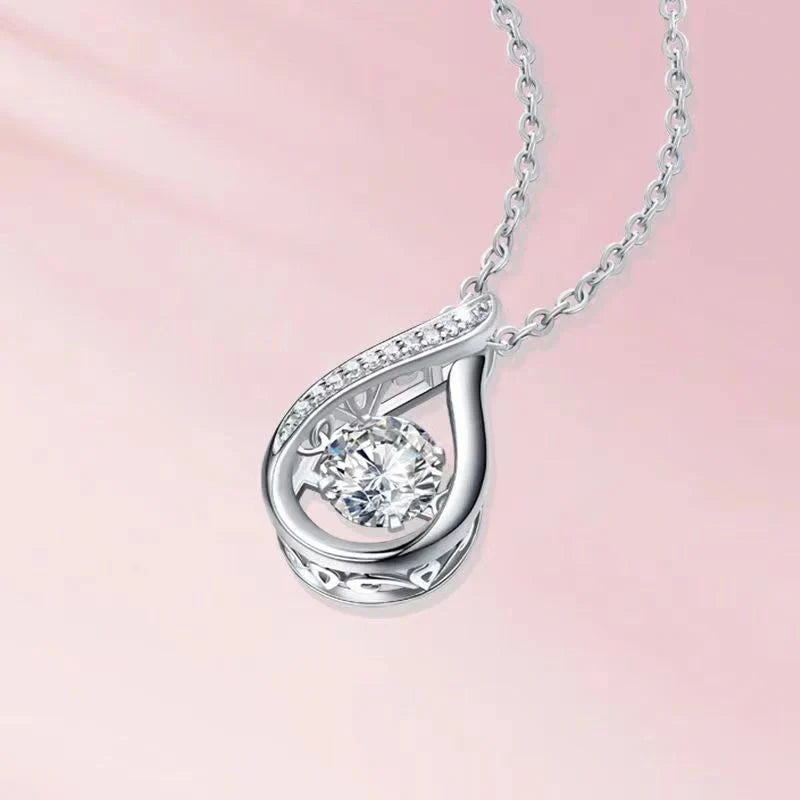 Elegant drop-shaped necklace in luxurious white gold, featuring a captivating water droplet design