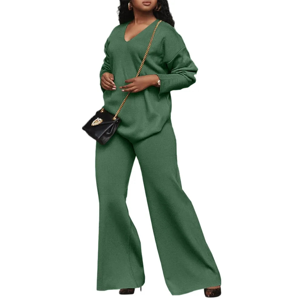 Women's brown suede two-piece suit with split sleeves on top and matching trousers