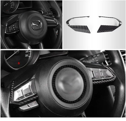 Carbon fibre patterned left and right steering wheel frame overlays for car interior upgrade.