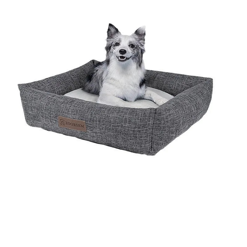 Grey linen-look square dog bed for medium-sized dogs on a wooden floor