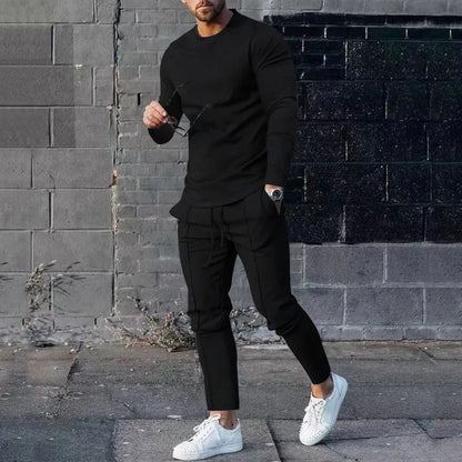 Men's solid colour two-piece lounge suit with long sleeve T-shirt and trousers in light grey.