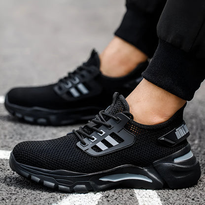Men's low-top black work shoe with Flyknit upper and steel toe cap on a grey background