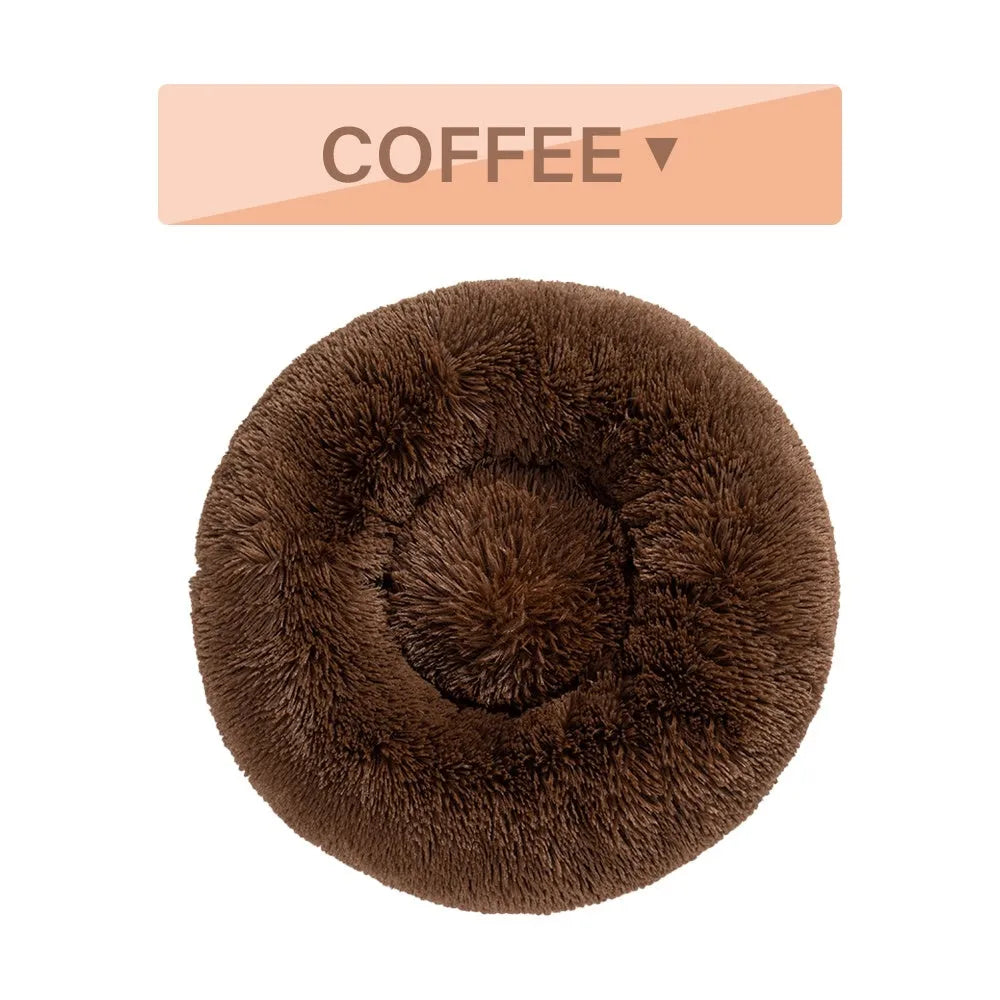 Fluffy donut-shaped pet bed with raised bolster edge in long plush material