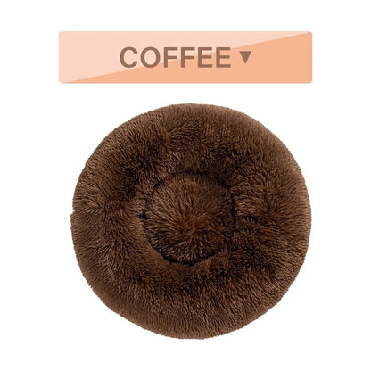 Fluffy donut-shaped pet bed with raised bolster edge in long plush material