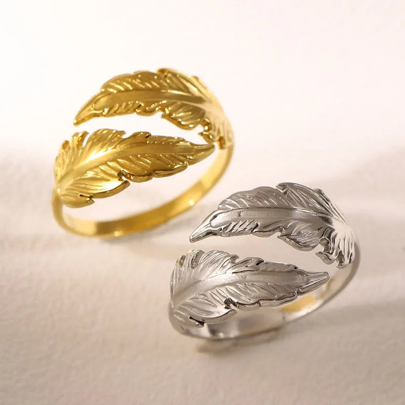 Women's stainless steel feather fashion ring with adjustable opening in silver or gold colour