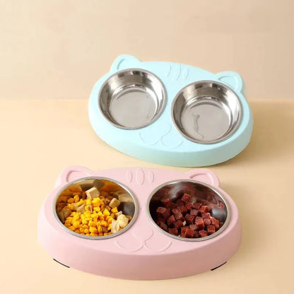 Blue macaron-shaped plastic pet feeder with two food bowls.