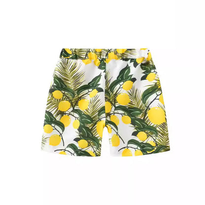 Multi-colour printed beach shorts with hairband belt on a mid-waist, shown in a casual summer style.