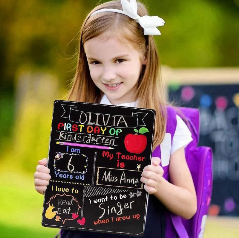 Wooden blackboard first day of school sign crafted from density plate, measuring 25.5 by 30 by 0.5 cm, a modern simplicity style ornament for back to school photos and nursery decoration.