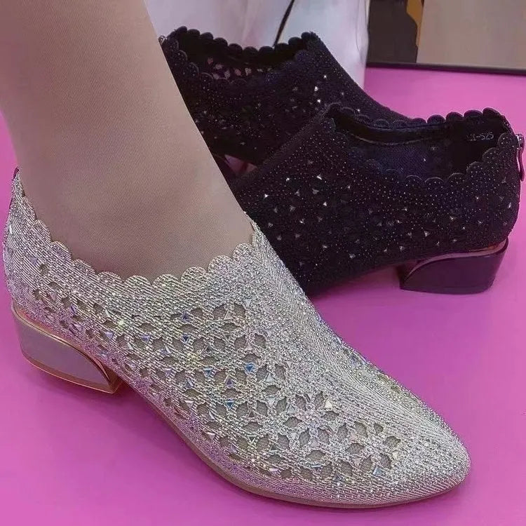 Women's chunky heel shoes with hollow-out upper, frosted full diamond detailing, round toe, canvas upper, and rubber sole.