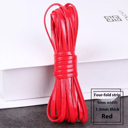 Coiled reels of PU leather craft string in multiple colours including beige, black, red, and blue.