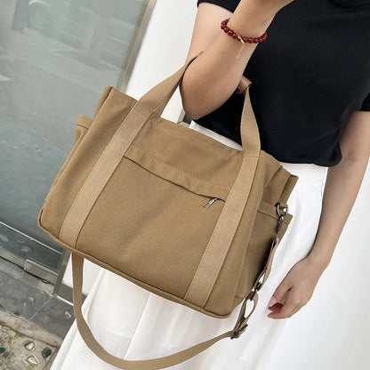 Large canvas tote bag in horizontal square shape with open-zip sides and internal organisers