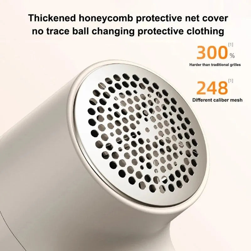 White electric lint remover with digital display showing six stainless steel blades and USB charging port