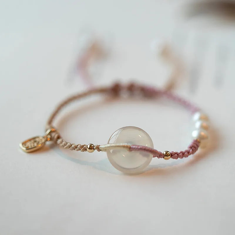 Ethnic style crystal bracelet with vintage woven strap and chamfered square grain details